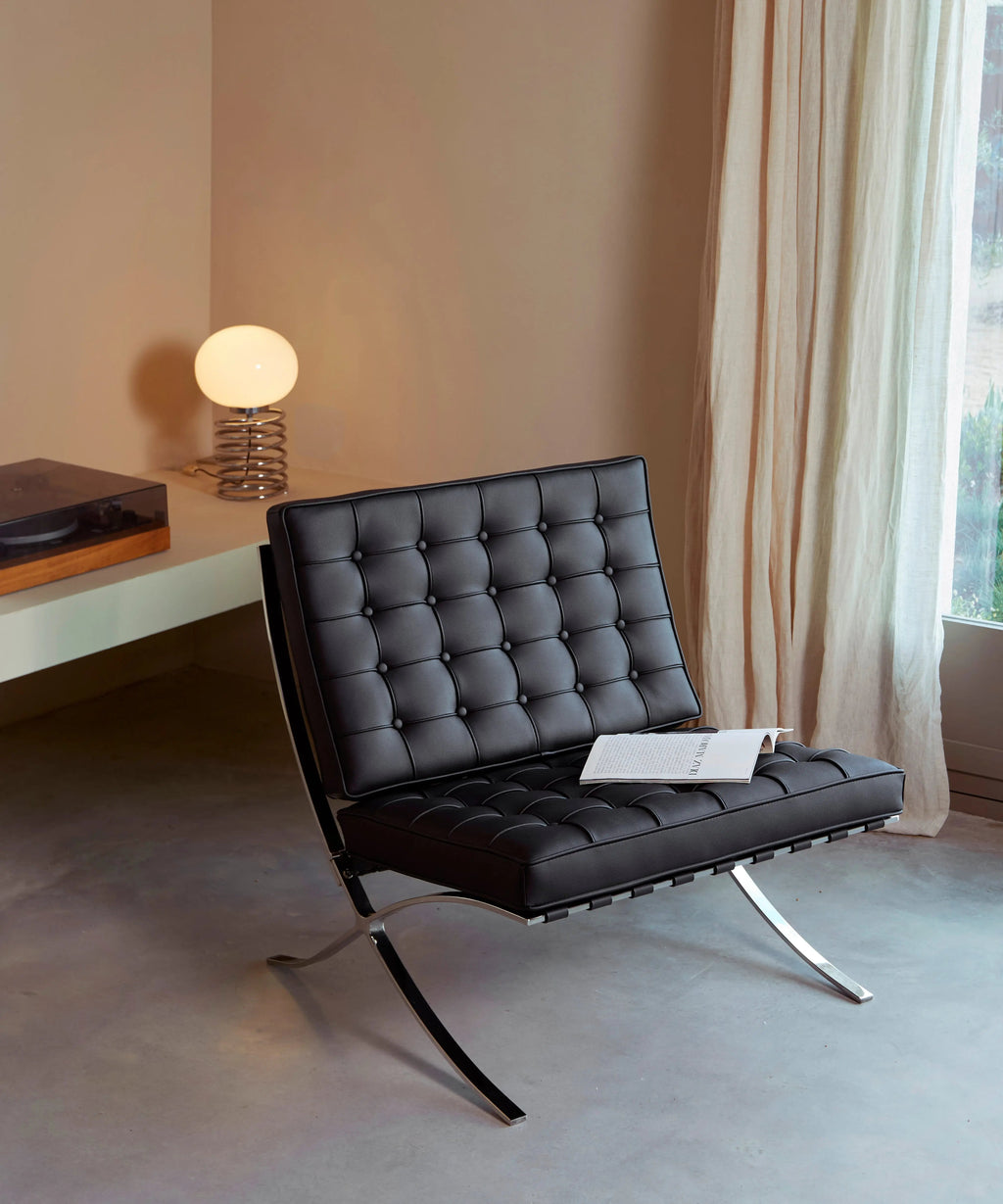 Chaise revêtue de cuir italien et acier Seline